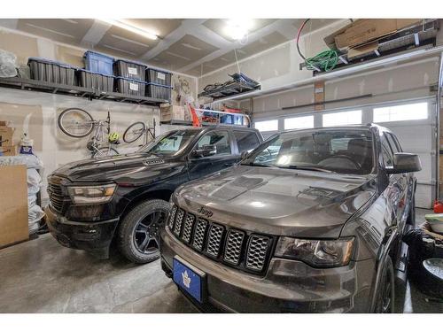 83 Sundown Way, Cochrane, AB - Indoor Photo Showing Garage