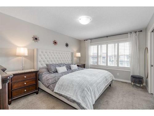 83 Sundown Way, Cochrane, AB - Indoor Photo Showing Bedroom