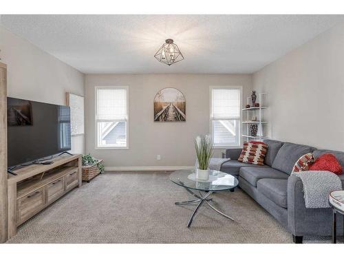 83 Sundown Way, Cochrane, AB - Indoor Photo Showing Living Room