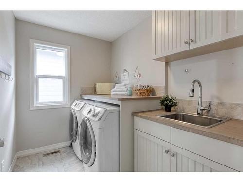 83 Sundown Way, Cochrane, AB - Indoor Photo Showing Laundry Room