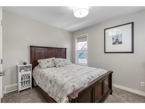 83 Sundown Way, Cochrane, AB - Indoor Photo Showing Bedroom