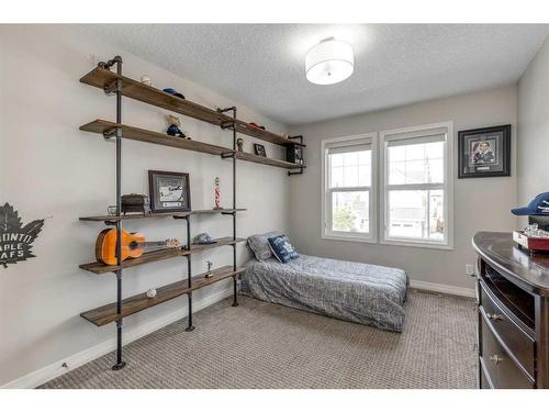 83 Sundown Way, Cochrane, AB - Indoor Photo Showing Bedroom