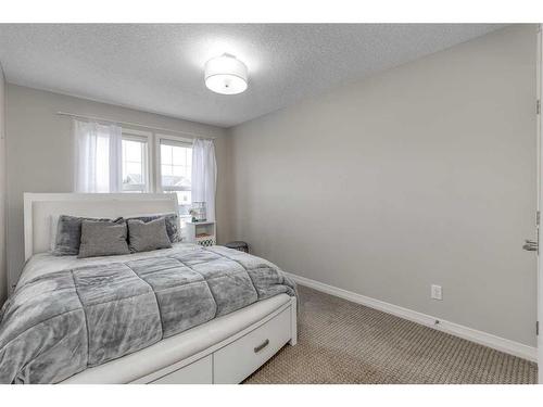 83 Sundown Way, Cochrane, AB - Indoor Photo Showing Bedroom