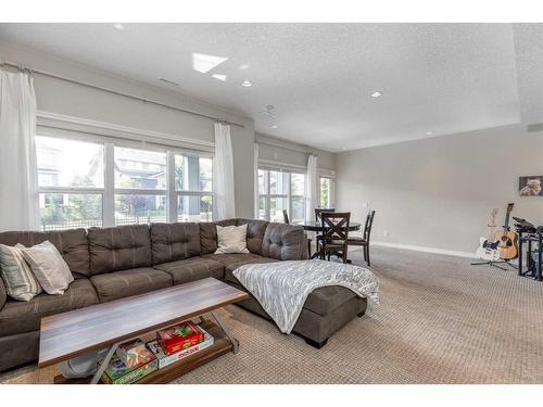 83 Sundown Way, Cochrane, AB - Indoor Photo Showing Living Room