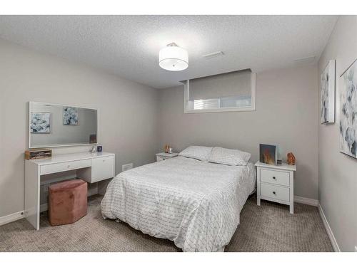 83 Sundown Way, Cochrane, AB - Indoor Photo Showing Bedroom