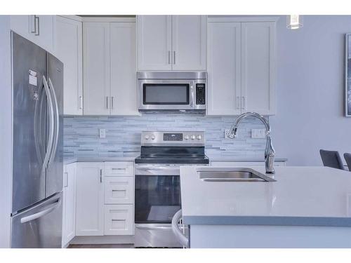 64 Evansglen Close Nw, Calgary, AB - Indoor Photo Showing Kitchen With Double Sink With Upgraded Kitchen