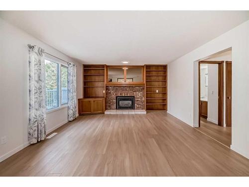 19 Macewan Ridge Close Nw, Calgary, AB - Indoor Photo Showing Living Room With Fireplace