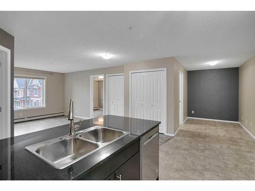 217-195 Kincora Glen Road Nw, Calgary, AB - Indoor Photo Showing Kitchen With Double Sink