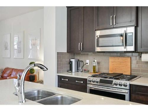 321 Marquis Heights Se, Calgary, AB - Indoor Photo Showing Kitchen With Double Sink With Upgraded Kitchen