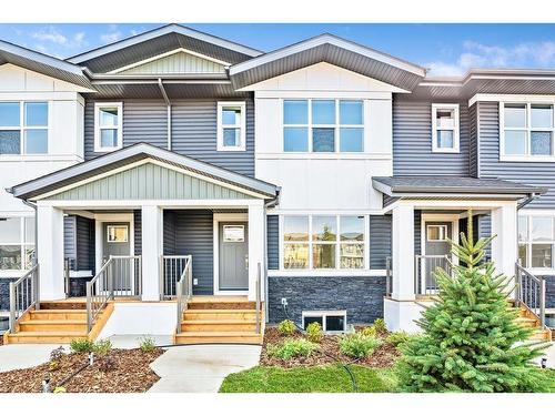 905-525 River Heights Drive, Cochrane, AB - Outdoor With Facade