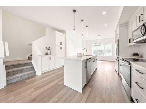 905-525 River Heights Drive, Cochrane, AB - Indoor Photo Showing Kitchen With Stainless Steel Kitchen With Upgraded Kitchen