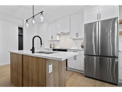 11120 Braeside Dr Sw, Calgary, AB - Indoor Photo Showing Kitchen With Stainless Steel Kitchen With Double Sink With Upgraded Kitchen