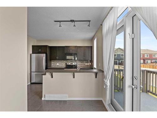 2302-125 Panatella Way Nw, Calgary, AB - Indoor Photo Showing Kitchen