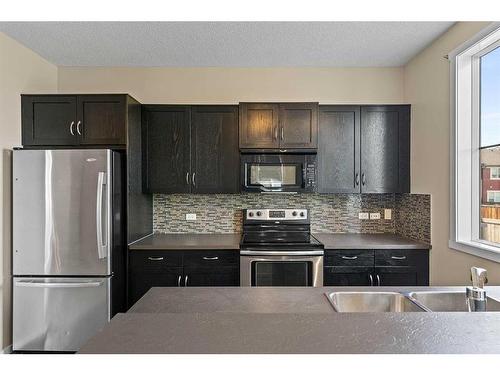 2302-125 Panatella Way Nw, Calgary, AB - Indoor Photo Showing Kitchen With Stainless Steel Kitchen With Upgraded Kitchen