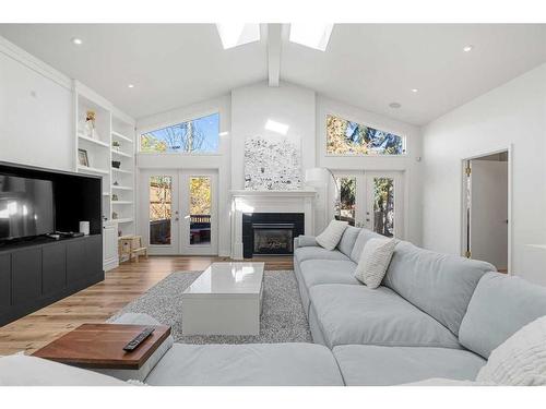 1102 Levis Avenue Sw, Calgary, AB - Indoor Photo Showing Living Room With Fireplace