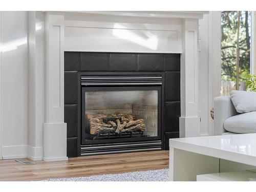 1102 Levis Avenue Sw, Calgary, AB - Indoor Photo Showing Living Room With Fireplace