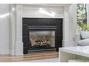 1102 Levis Avenue Sw, Calgary, AB  - Indoor Photo Showing Living Room With Fireplace 