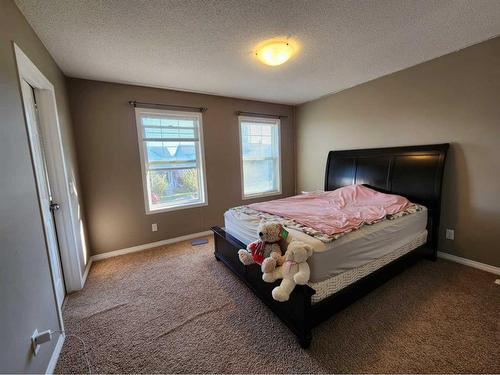 1061 Panatella Boulevard Nw, Calgary, AB - Indoor Photo Showing Bedroom