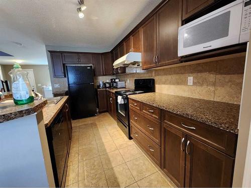 1061 Panatella Boulevard Nw, Calgary, AB - Indoor Photo Showing Kitchen