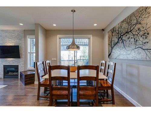 87 Panton View Nw, Calgary, AB - Indoor Photo Showing Dining Room With Fireplace