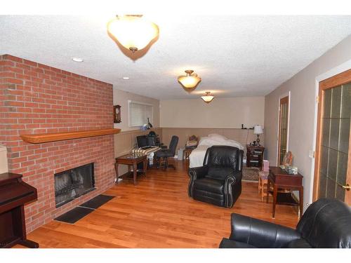 147 Berkshire Close Nw, Calgary, AB - Indoor Photo Showing Living Room With Fireplace