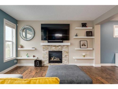 9 Nolanfield Point Nw, Calgary, AB - Indoor Photo Showing Living Room With Fireplace