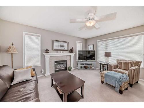 169 Rockbluff Close Nw, Calgary, AB - Indoor Photo Showing Living Room With Fireplace