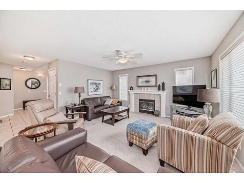 169 Rockbluff Close Nw, Calgary, AB - Indoor Photo Showing Living Room With Fireplace