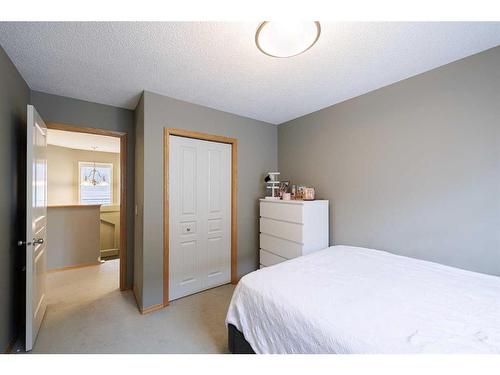 12461 Crestmont Boulevard Sw, Calgary, AB - Indoor Photo Showing Bedroom