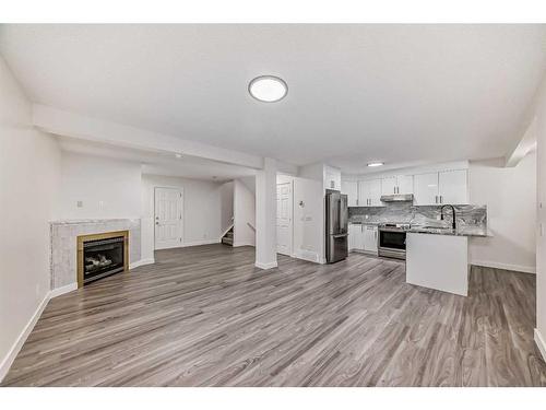 91 Saddleback Way Ne, Calgary, AB - Indoor With Fireplace