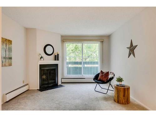 8203-315 Southampton Drive Sw, Calgary, AB - Indoor Photo Showing Living Room With Fireplace