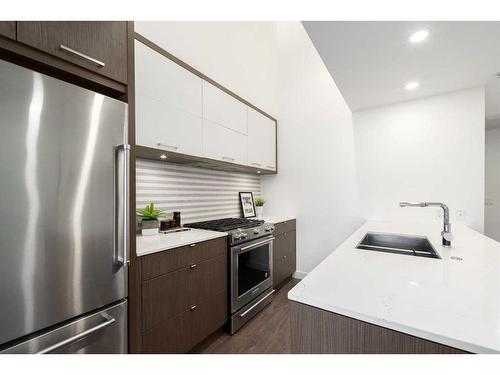 403-3450 19 Street Sw, Calgary, AB - Indoor Photo Showing Kitchen With Stainless Steel Kitchen With Double Sink With Upgraded Kitchen