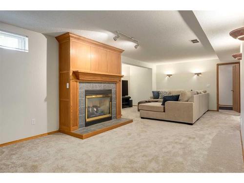 75 Hawkstone Close Nw, Calgary, AB - Indoor Photo Showing Other Room With Fireplace