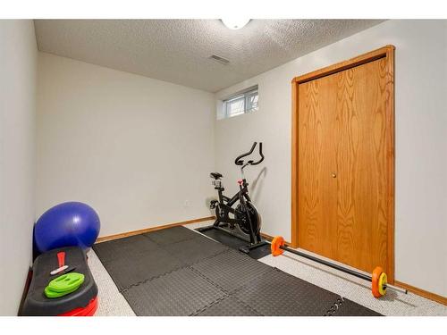 75 Hawkstone Close Nw, Calgary, AB - Indoor Photo Showing Gym Room