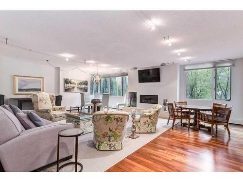 202C-500 Eau Claire Avenue Sw, Calgary, AB - Indoor Photo Showing Living Room With Fireplace