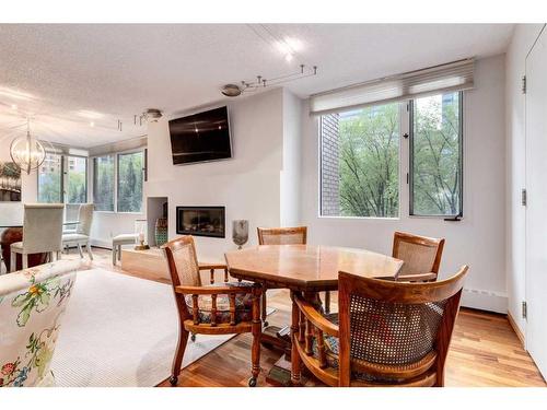 202C-500 Eau Claire Avenue Sw, Calgary, AB - Indoor Photo Showing Living Room With Fireplace