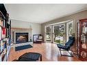 927 Riverbend Drive Se, Calgary, AB  - Indoor Photo Showing Living Room With Fireplace 