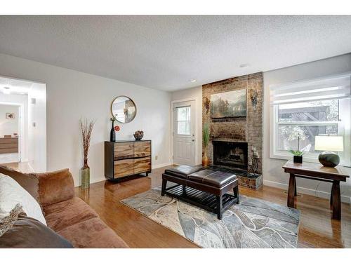 14127 Parkside Drive Se, Calgary, AB - Indoor Photo Showing Living Room With Fireplace