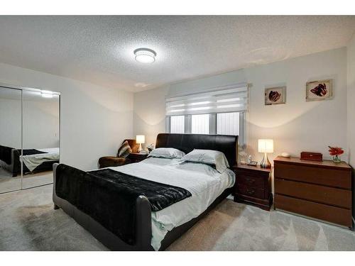 14127 Parkside Drive Se, Calgary, AB - Indoor Photo Showing Bedroom