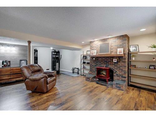 14127 Parkside Drive Se, Calgary, AB - Indoor Photo Showing Living Room With Fireplace