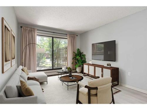 105-1602 11 Avenue Sw, Calgary, AB - Indoor Photo Showing Living Room