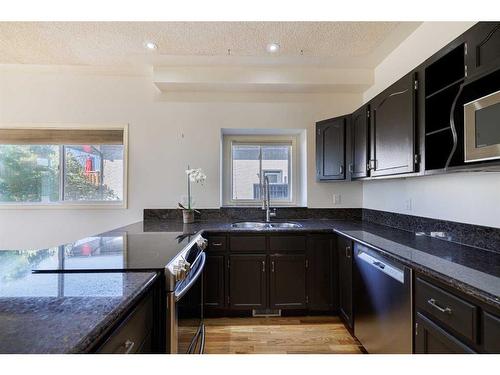 933 Drury Avenue Ne, Calgary, AB - Indoor Photo Showing Kitchen With Double Sink