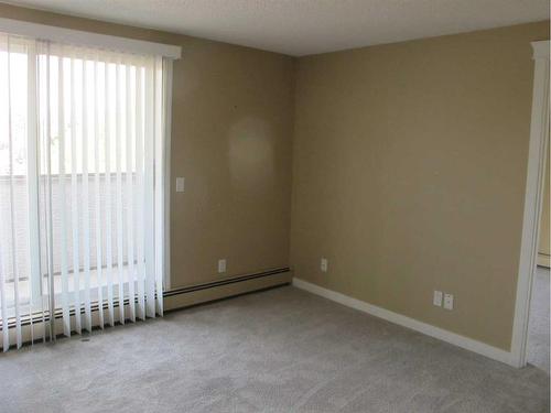 302-280 Banister Drive, Okotoks, AB - Indoor Photo Showing Other Room