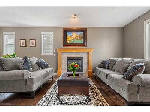 14 Rockyspring Point Nw, Calgary, AB - Indoor Photo Showing Living Room With Fireplace