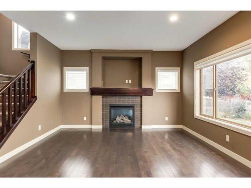 532 Everbrook Way Sw, Calgary, AB - Indoor Photo Showing Other Room With Fireplace