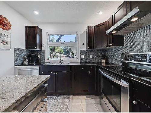 36 Oakbury Place Sw, Calgary, AB - Indoor Photo Showing Kitchen With Double Sink