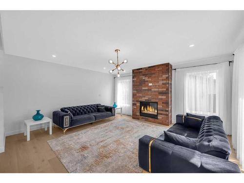 7216 5 Street Sw, Calgary, AB - Indoor Photo Showing Living Room With Fireplace