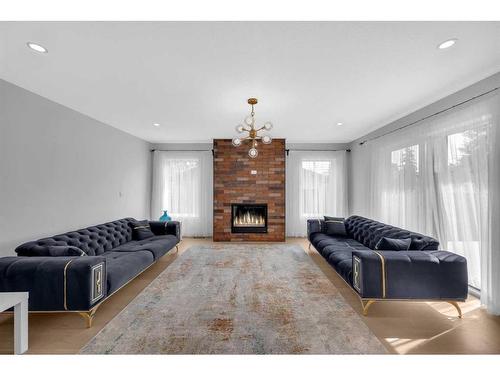 7216 5 Street Sw, Calgary, AB - Indoor Photo Showing Living Room With Fireplace