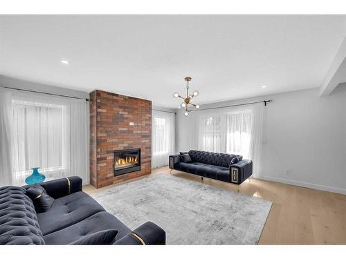 7216 5 Street Sw, Calgary, AB - Indoor Photo Showing Living Room With Fireplace