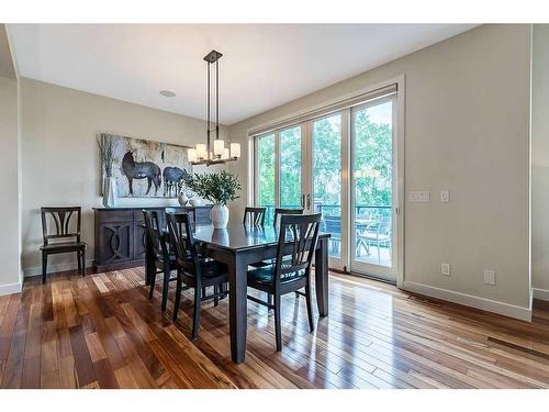 24 Ascot Place Sw, Calgary, AB - Indoor Photo Showing Dining Room With Fireplace